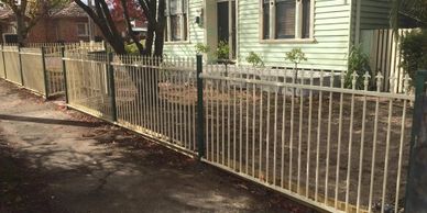 White tubular fence